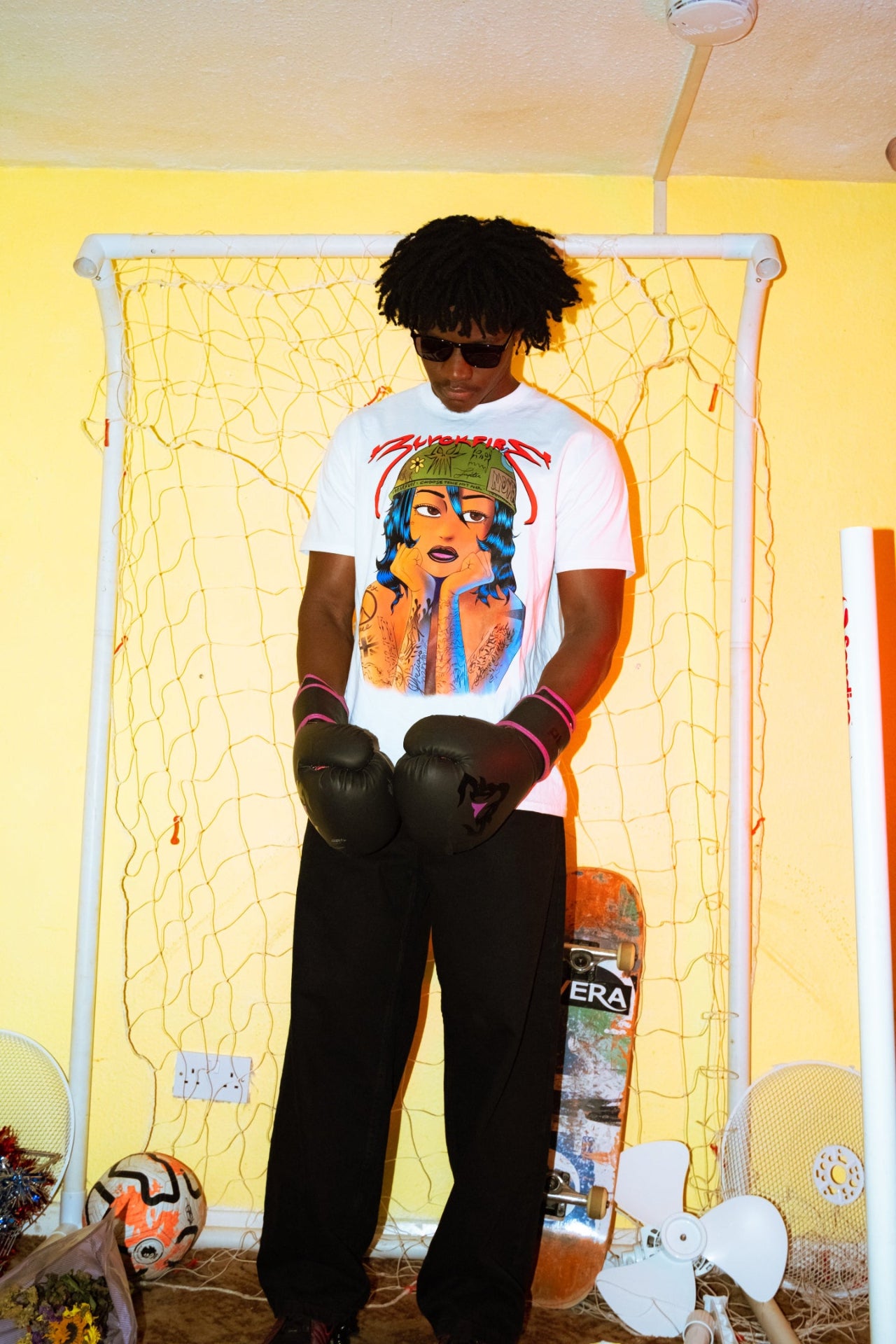 Model wearing blvckfire army girl tshirt