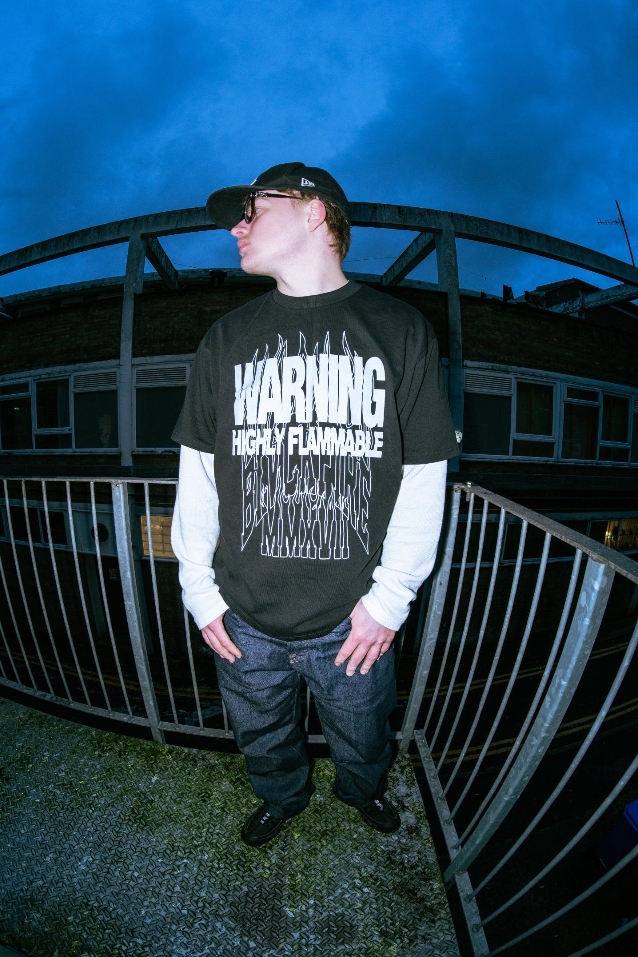 Model wearing blvckfire warning tshirt