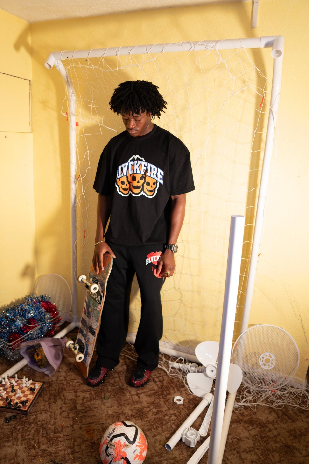 Model wearing blvckfire 3 skulls tshirt