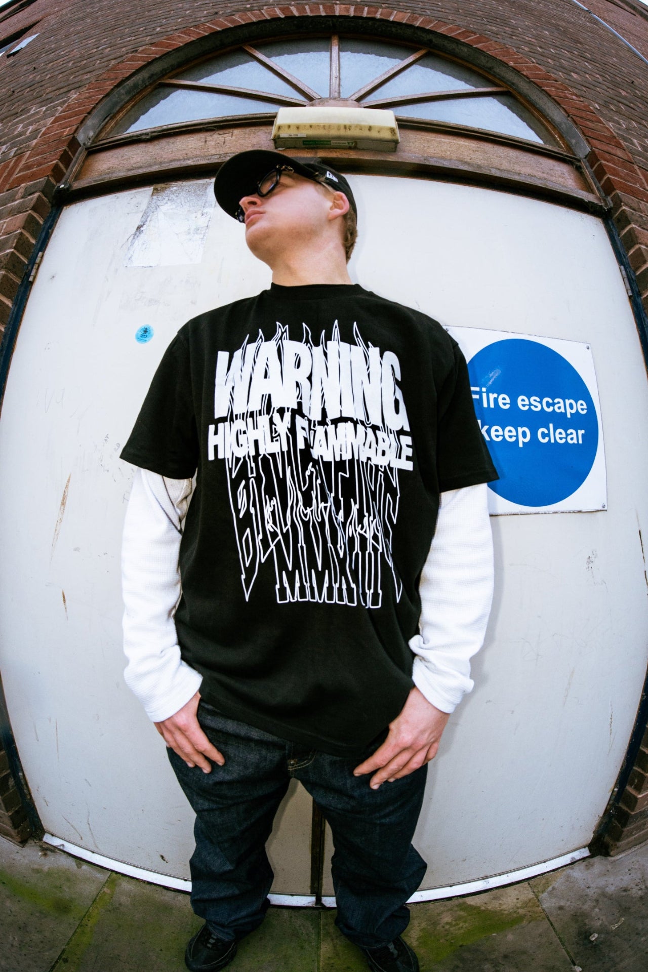 Model wearing blvckfire warning tshirt