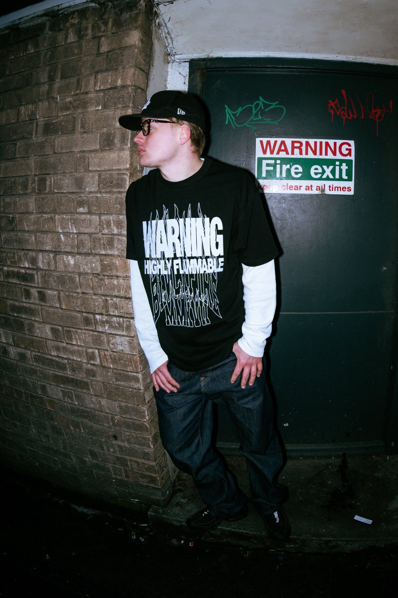 Model wearing blvckfire warning tshirt