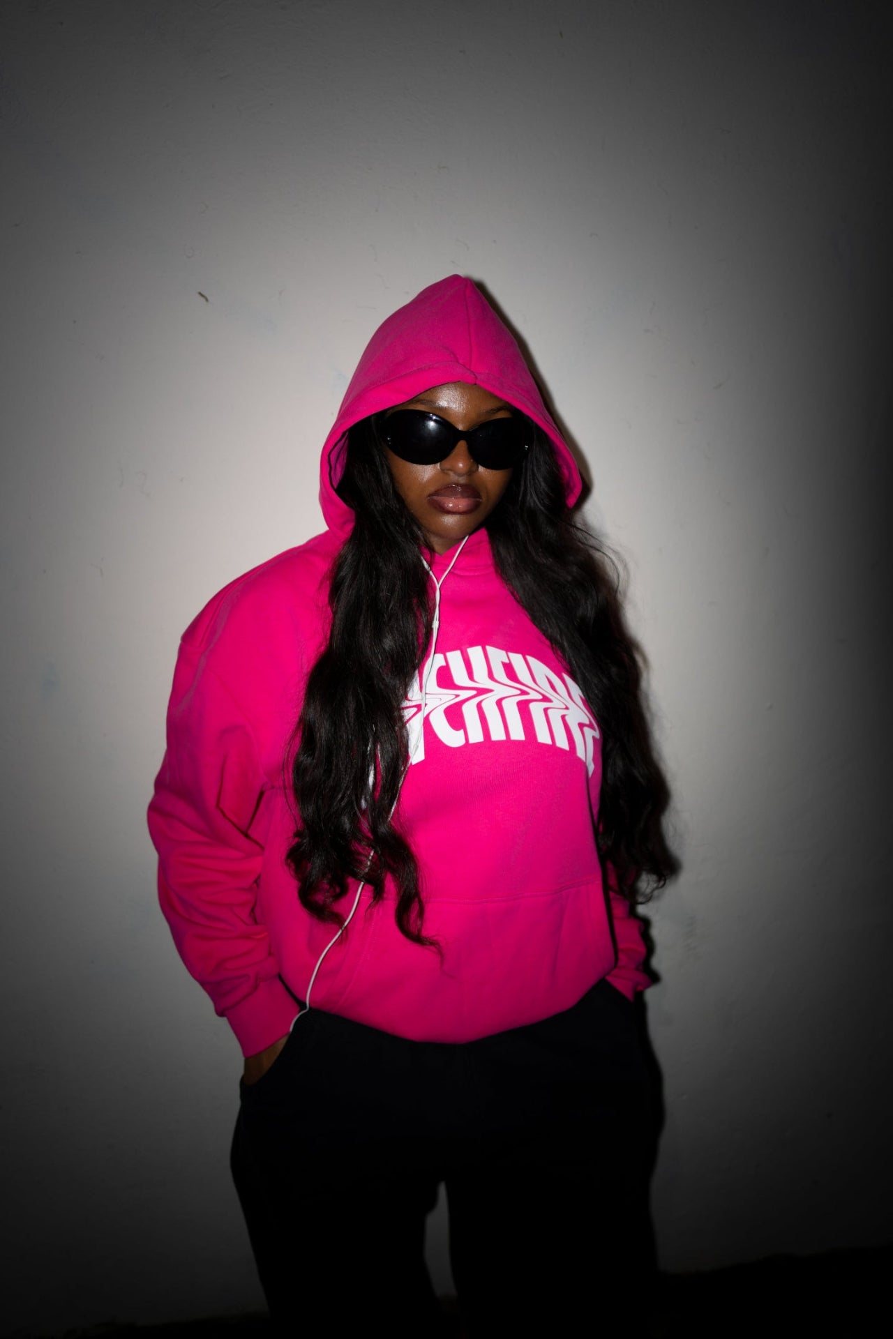 Model wearing pink blvckfire warped hoodie