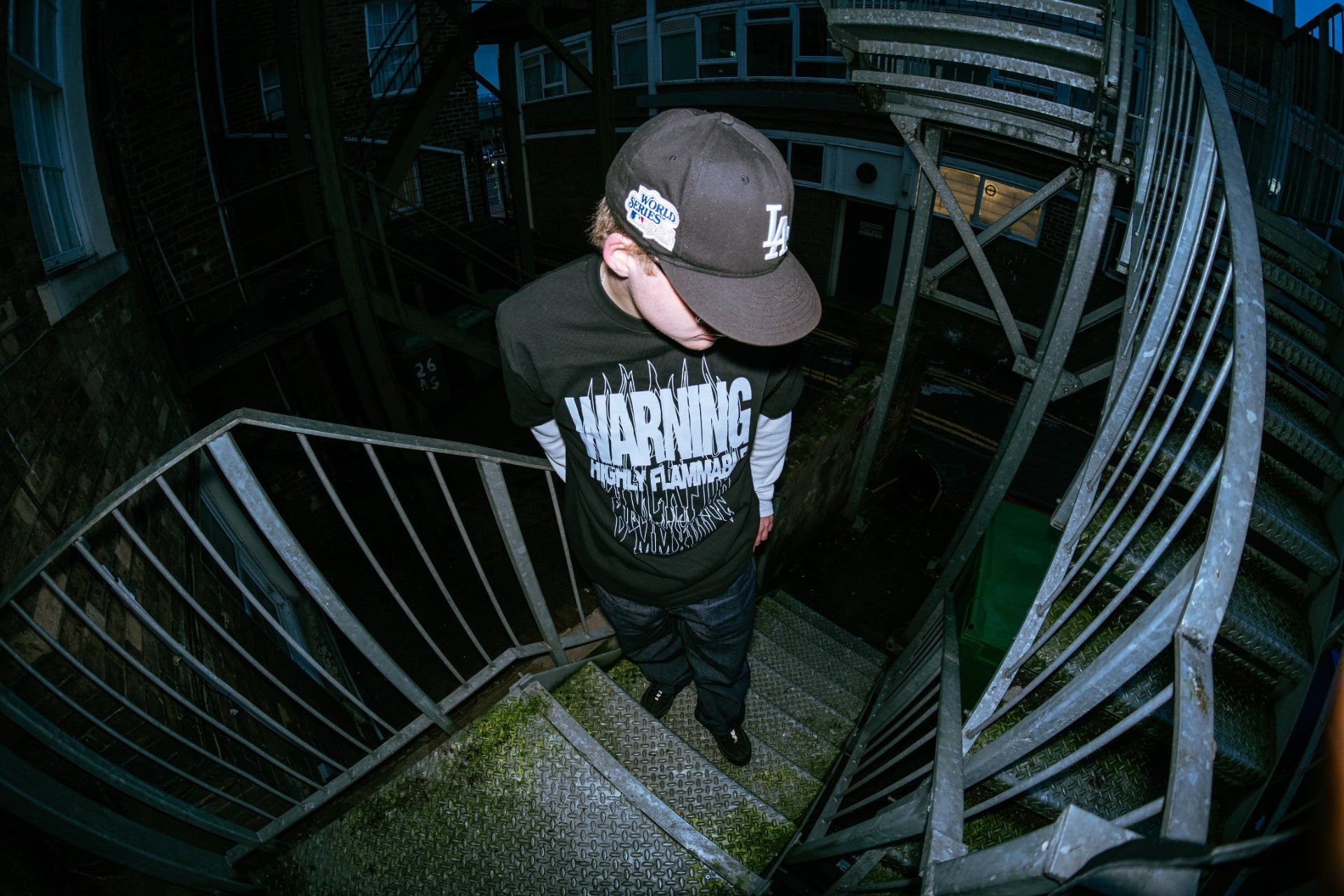 Model wearing blvckfire warning tshirt